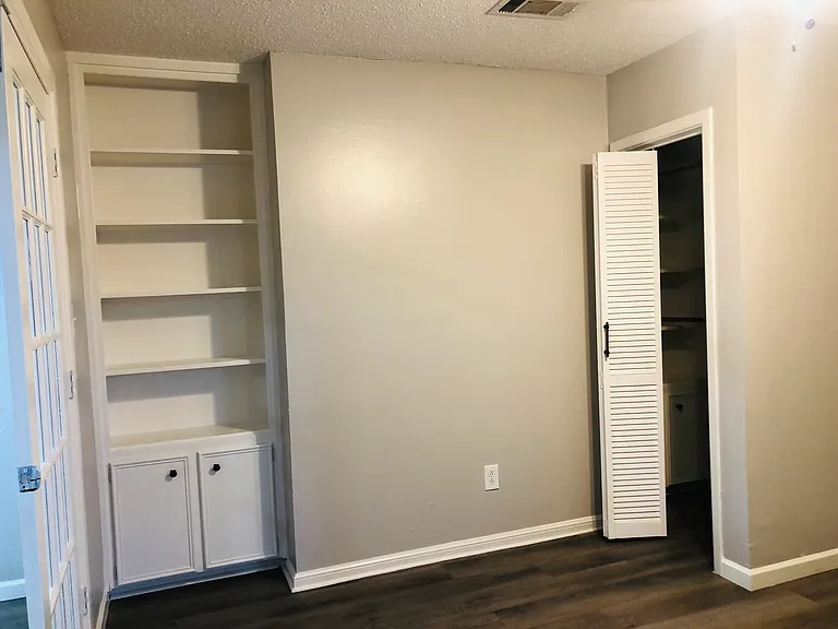4th bed or office. French doors lock for privacy. Has closet and book shelves.