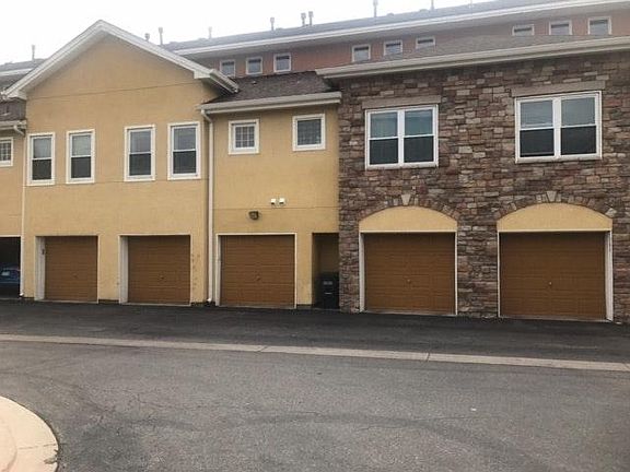 Back of Townhome. Single car garage.