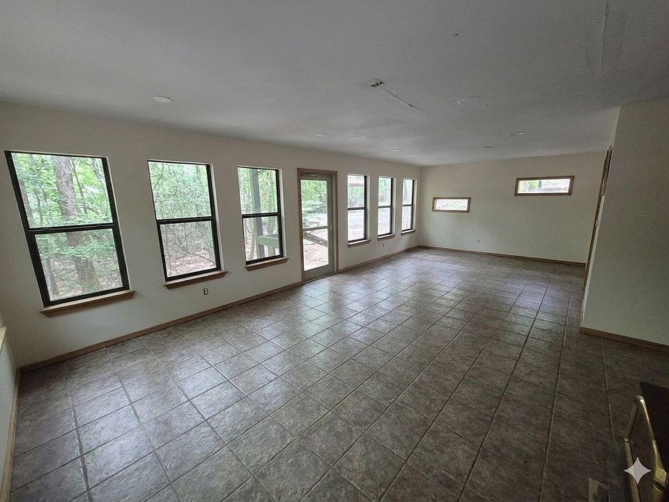 All purpose room w PTAC heat and air and wood burning stove