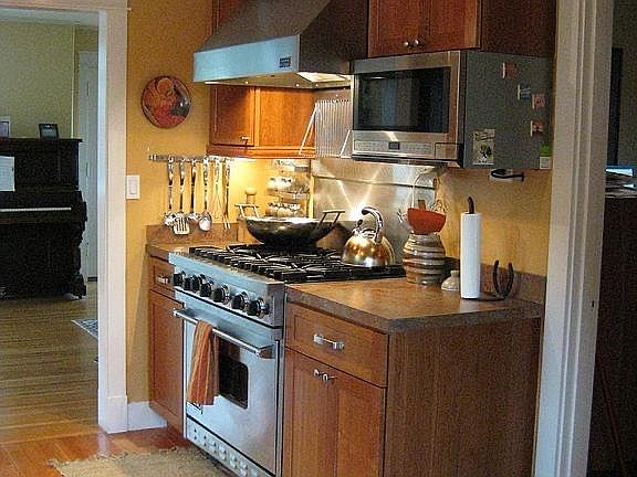 Six burner stove with hood. 
Built in microwave.