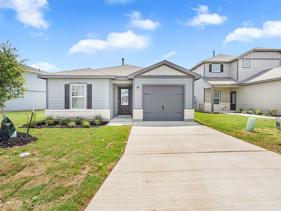 The Beech plan by LGI Homes with beautiful front yard landscaping