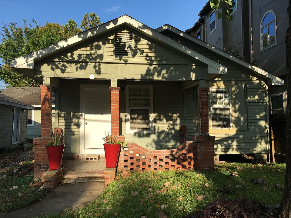 The front of the home. The covered porch is lovely for relaxation and take in the sunrise and sunset. (Note the storage unit to the left of the home is not included with the rental.)