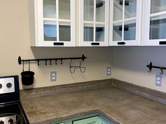 Concrete countertops with glass, soft close cabinets