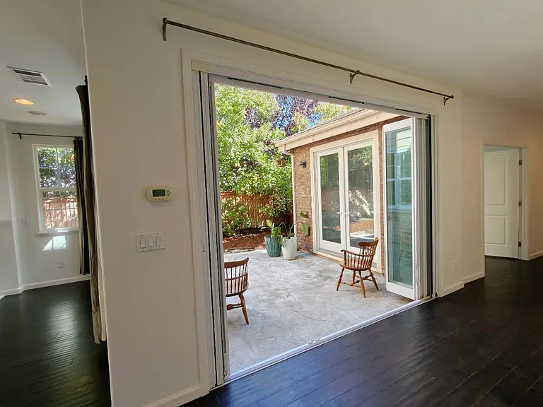 Private side courtyard perfect for outdoor dining, entertaining, or relaxing