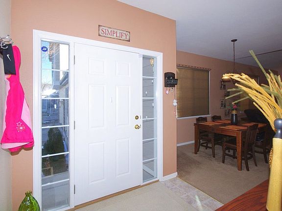 Linoleum vinyl entry with closet.  Dining room to the left upon entry