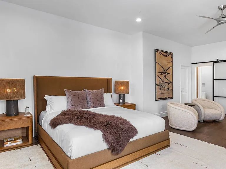 Luxurious bedroom suite with plush bedding and elegant furnishings.