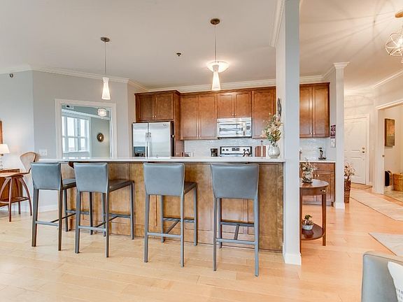 Quick meals on the go are easily accommodated with the expansive breakfast bar; perfect for additional seating.