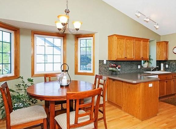 Nice kitchen with open layout and tiled backsplash!