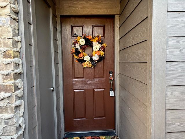 The front entrance is under a cover so in the extreme weather, you are out of the rain, wind, hail and heat as you unlock your door. To the left, is a storage closet for your use.
