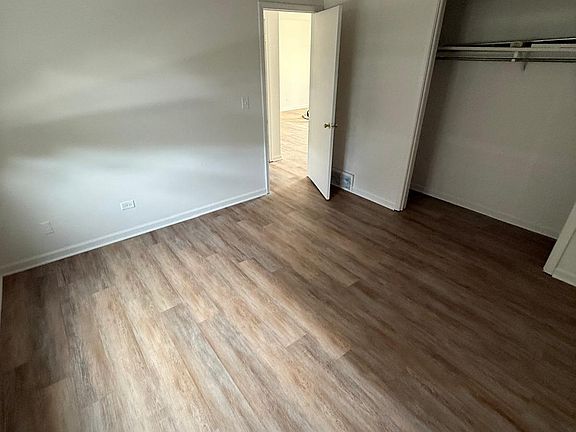 Bedroom #2 with fresh paint and brand new flooring.