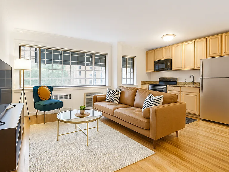 Modern and inviting open-concept living space featuring a sleek kitchen