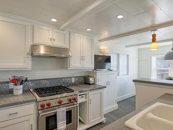 Roomy kitchen with separate dining table area.