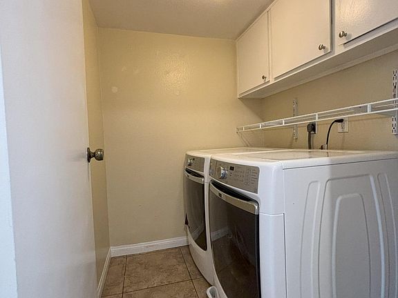 Washer and dryer. Entrance to the laundry room is on the far left in photo of kitchen