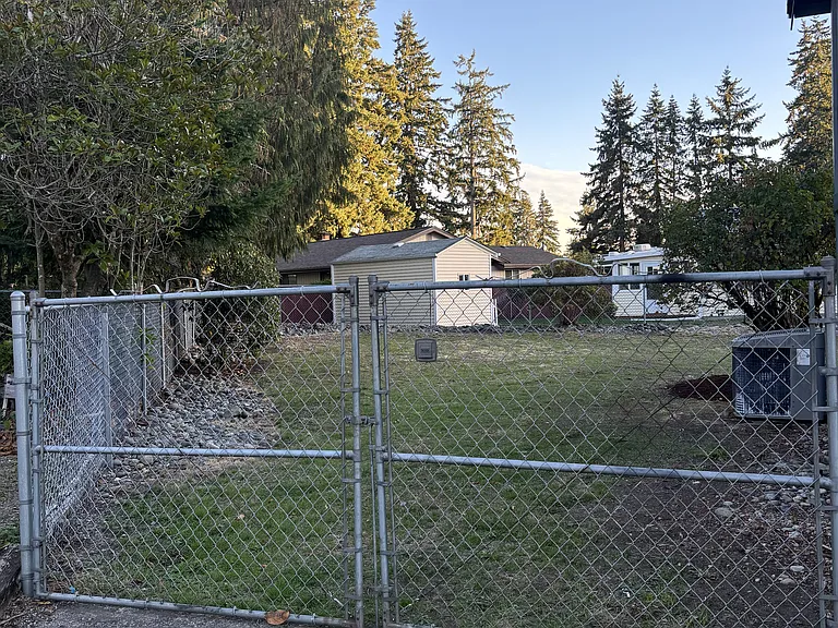 View of side yard with full access gate
