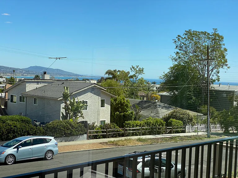 Daytime view off balcony. Very close to ocean for walking. Lots of good street parking in addition to driveway and garage.