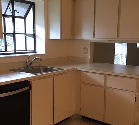 Eat-in kitchen with greenhouse window and lots of cabinets