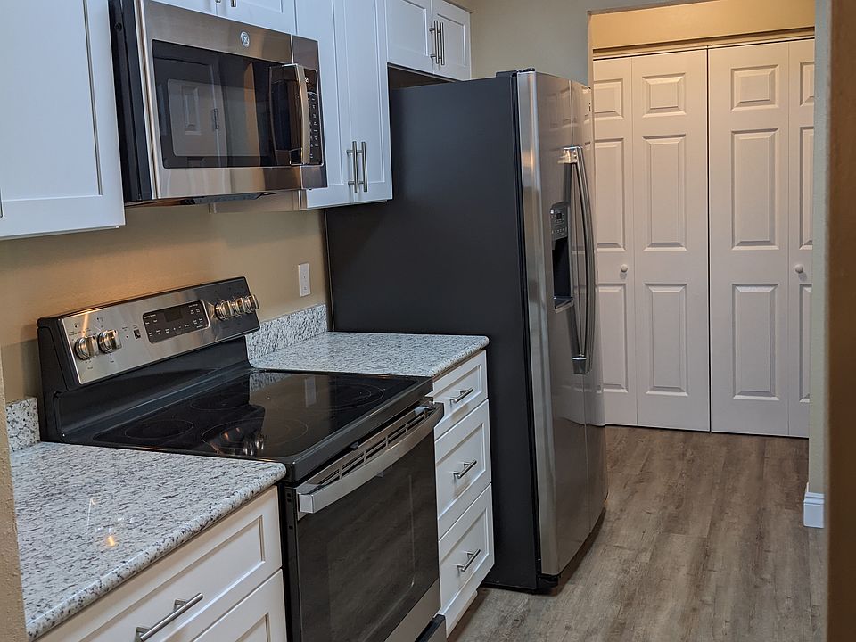Laundry with storage behind Bifold Doors