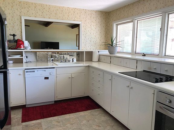 Kitchen features plenty of work space and lots of storage! Also has a large pantry with custom organizers.