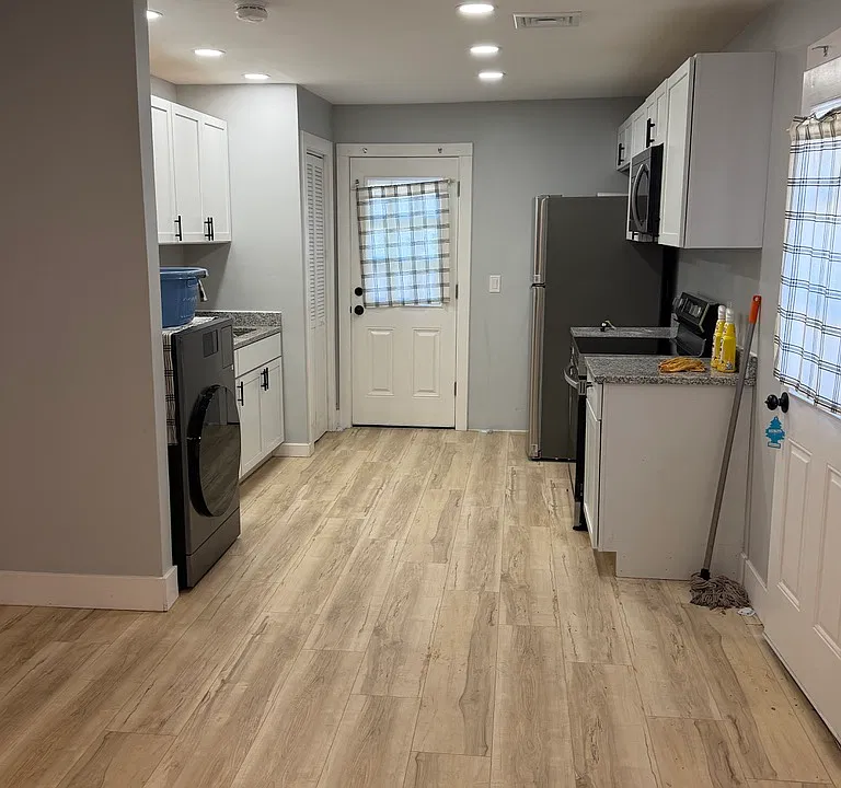 Kitchen - Comes with Stove, Microwave, Refrigerator, and Washer/Dryer Combo Unit.