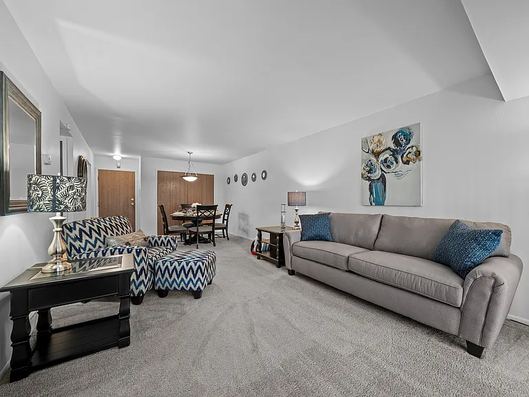 Spacious living room with natural light at Westwood Village Apartments in Westland, MI