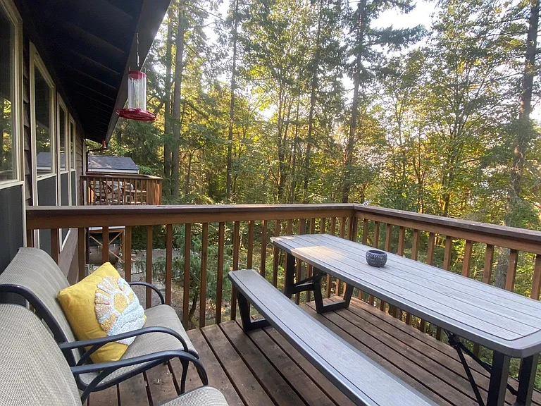 Kitchen Deck overlooking wooded area and Master Bedroom Deck.