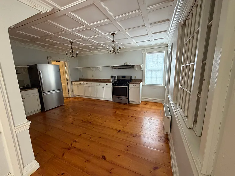 The kitchen has plenty of floor space if tenants would like to bring a moveable island. The kitchen also has a brand new refridgerator