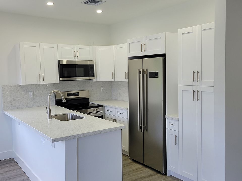 Bright and functional kitchen with ample cabinetry and natural light.