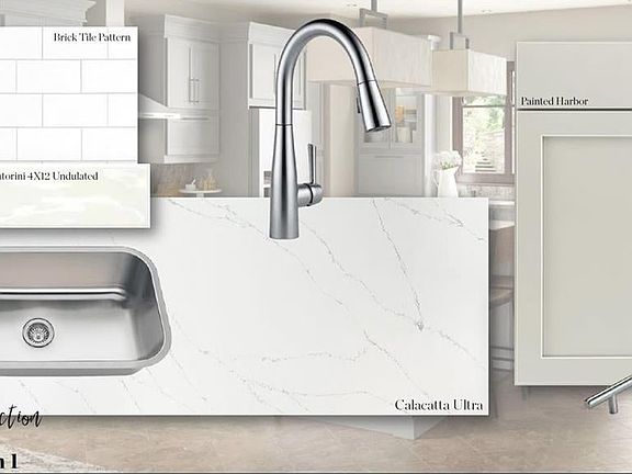 Kitchen has soft gray cabinets all soft close and quartz Cambria coutnertops