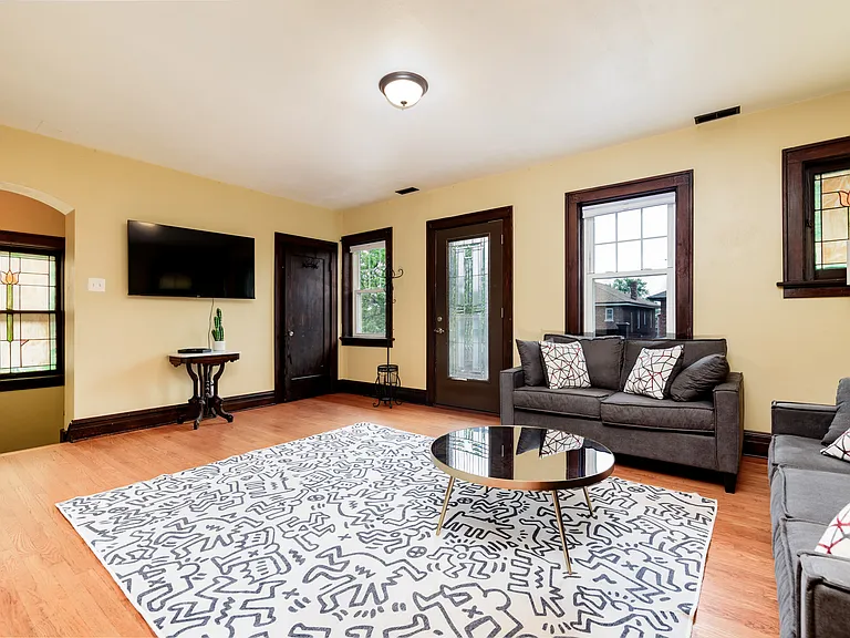 Large Living Room, door to front balcony, large walk in coat closet