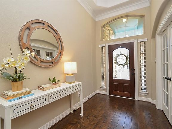 Elegant hardwood flooring in the warm entry.