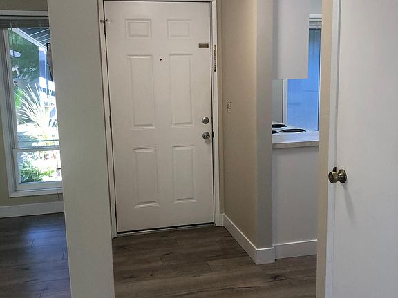 Entry hall with DR off to left and kitchen off to right. Also storage closet.