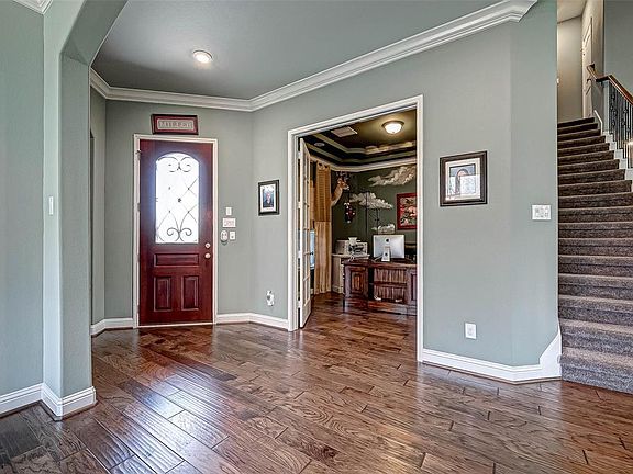 View of the Entry Way looking back at the Front Door. As you walk in the Office is on your left and the Guest Bedroom is on your right.