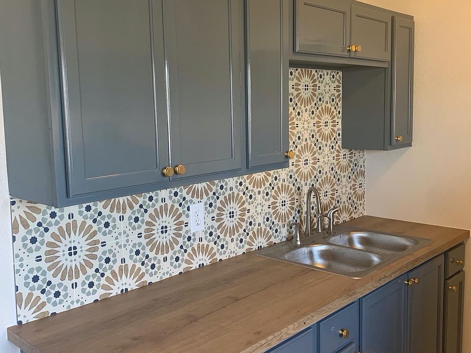 Kitchen with custom backsplash tile