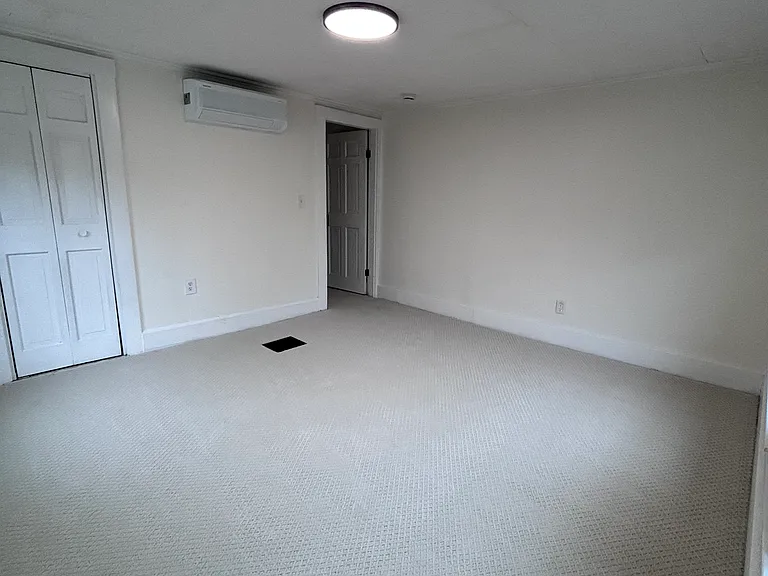 Bedroom with mini split AC unit