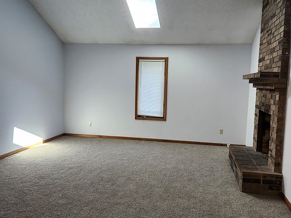Vaulted living room with skylight