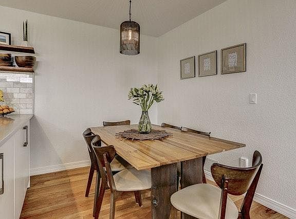 Dining room with light fixture.