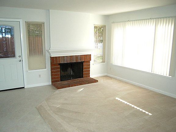 Formal Living Room with Brick Fireplace
