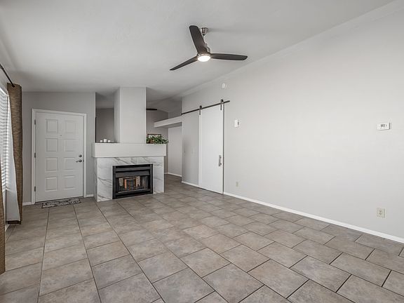 Great Room features vaulted ceilings, and a two sided fireplace.