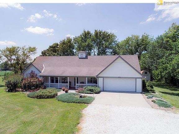 OVER 3000 SQ FT WITH DOUBLE SIDED FRONT PORCH AND ATTRACTIVE LANDSCAPING