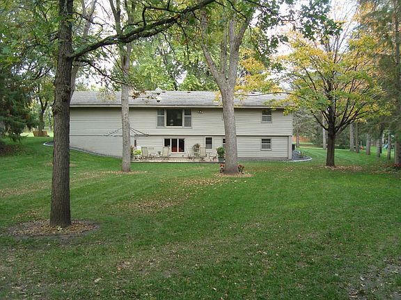 Big private 1/2 ac lot. Enough space to add on to home. Plenty of flat play area and room for a pool-facing west & south.  Garage is heated with tons of storage - cupboards and workbench with drawers & vise. Lots of room to add on to house.