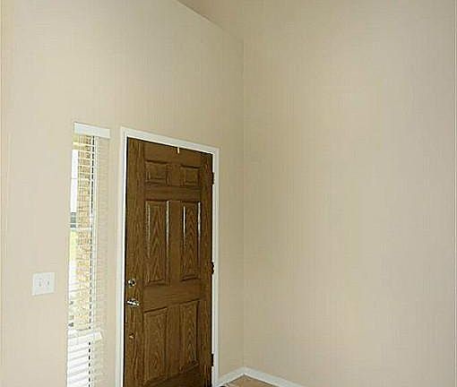 Two story entry warmly welcomes guests.
