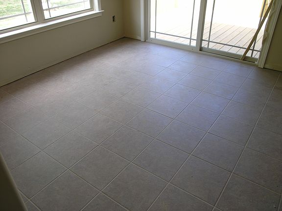 Ceramic tile at breakfast walk out to deck