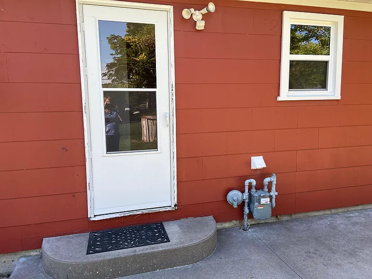 Storm doors on front and rear of home.