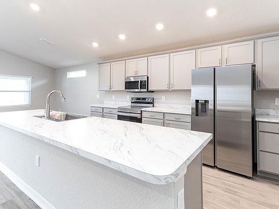 Your kitchen is complete with Samsung SS appliances, 36-in. cabinets, and a large single-bowl sink -