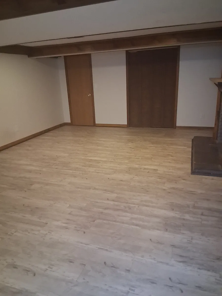 Large family room with laundry room closet. - 63 Edgewood Rd #B