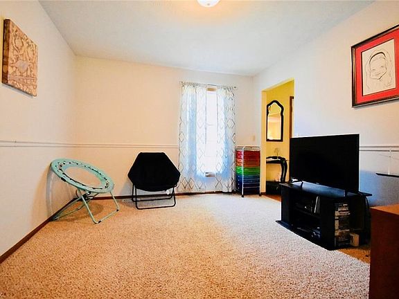 This is the formal dining room which can be utilized for other needs such as a media room/office/extra bedroom. It measures 14x1