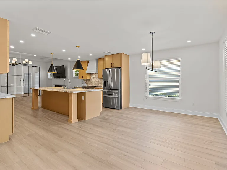 View of dining area and kitchen upon entry