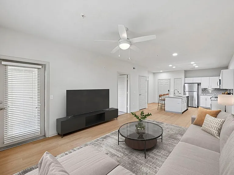Renovated Package I living room with hard surface flooring
