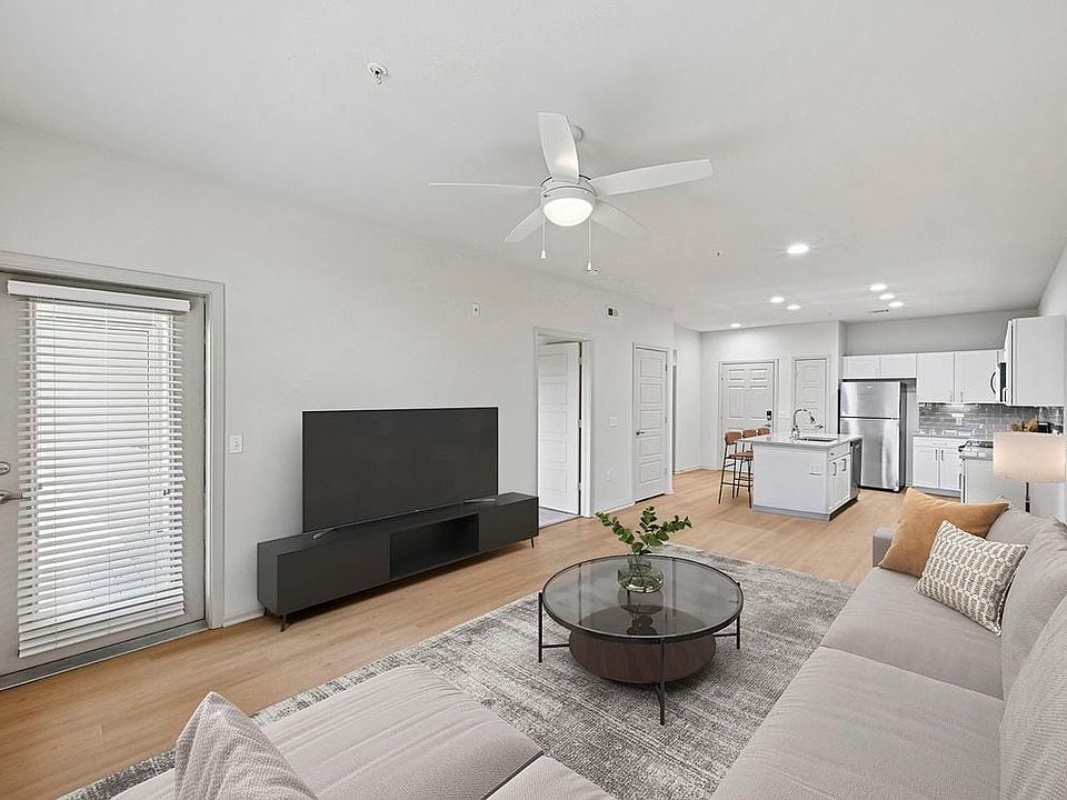 Renovated Package I living room with hard surface flooring