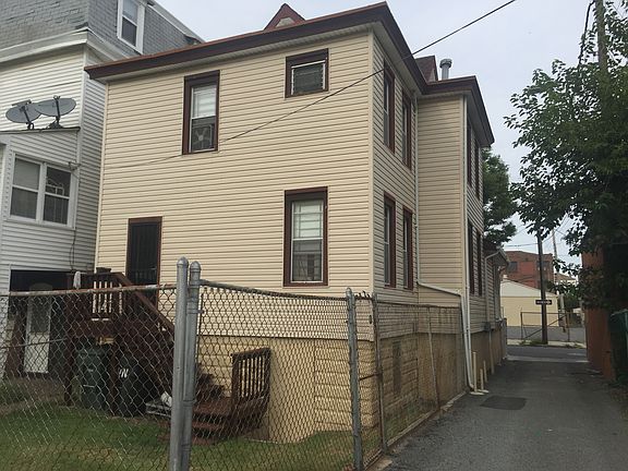 Rear view of home with fence